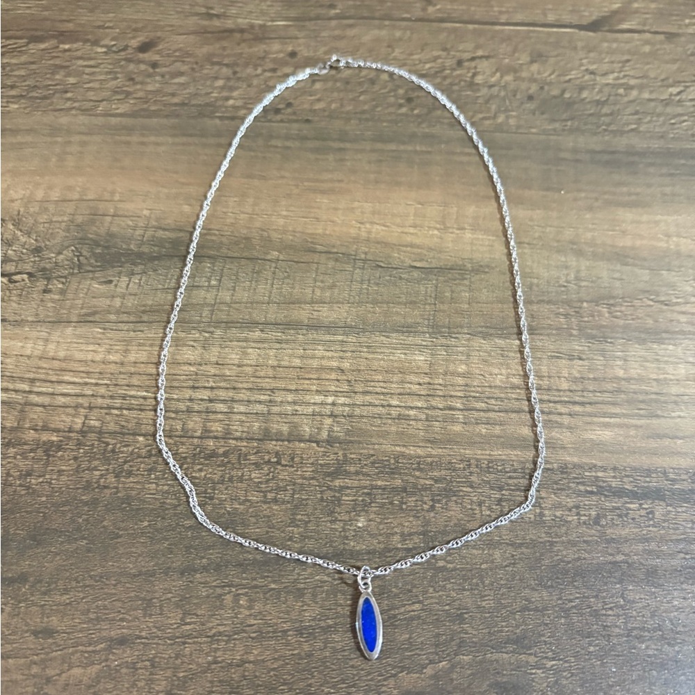 Silver colored necklace with Blue stone Pendant